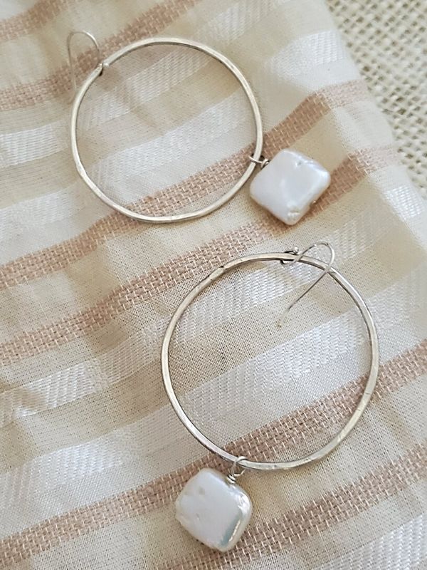 pearl hoop earrings on fabric